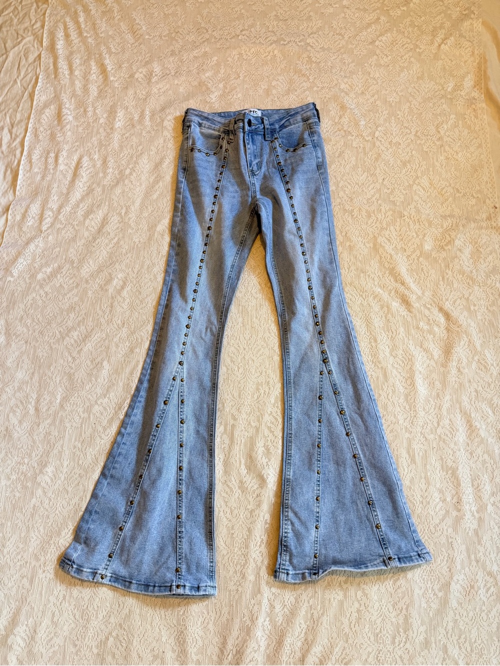 PCTL ethical clothing studded light wash flare jeans